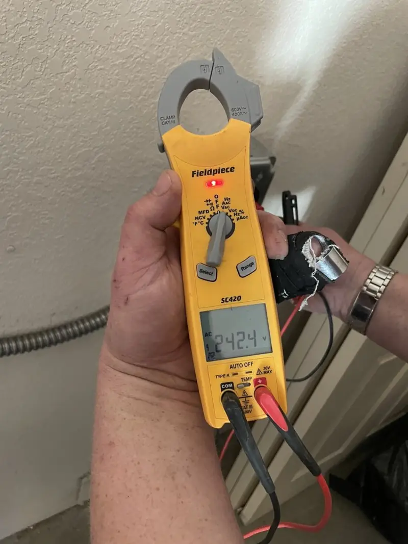 Voltage testing with clamp meter during Circuit Breaker Repair in Carlsbad